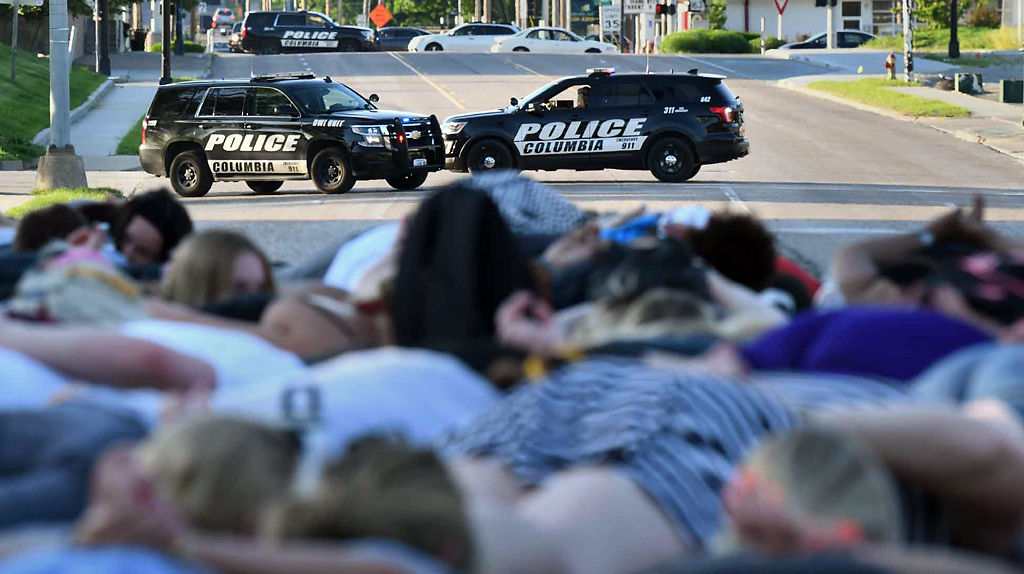 Police vehicles block Providence during a protest